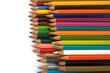 Assortment of coloured pencils with shadow on white background