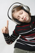 Young girl listening to the music wth headphones