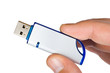 Flash drive in hand, isolated on white background Flash drive in hand, isolated on white background