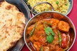 Chicken curry with naan bread and pilau rice