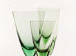 Photo: A glass beside a stack of white plates - on white background A glass beside a stack of white plates - on white background