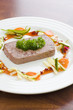 Gourmet game Pâté with vegetables and jam on the table Gourmet game Pâté with vegetables and jam on the table