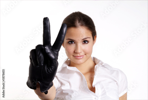 Photo: pretty woman with long hair and black leather glove pretty woman with long hair and black leather glove