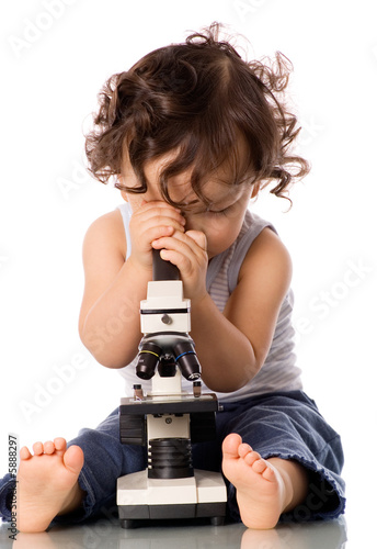 Baby with microscope.