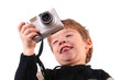 Isolated photo of young boy taking a photograph