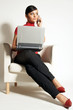 Atractive brunet businesswoman with Laptop and phone