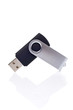 Flash pendrive memory reflected on white background. Shallow DOF