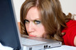 A girl frustrated with her laptop.