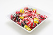a bowl of hard candy shot on white, very colorful 