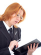 Young red-haired businesswoman with pen and notebook