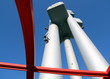 Metal TV tower a blue sky.