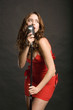 Beautiful sexy young woman singing