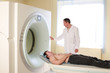 Patient and doctor ready to do CAT scan with CT scanner.