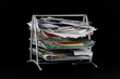 Messy in-basket with papers Messy in-basket with papers