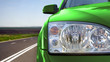 Green car on the road