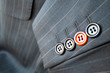 Orange button standing out on a businessman suit