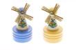 Miniature wooden windmills on white background