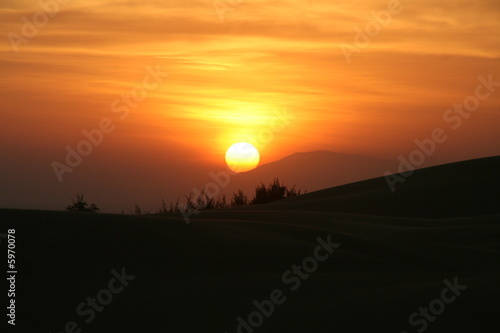 Photo: Sonnenuntergang an den roten Dünen in Mui Ne Sonnenuntergang an den roten Dünen in Mui Ne