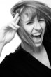 Screaming woman shielding her eyes from the light