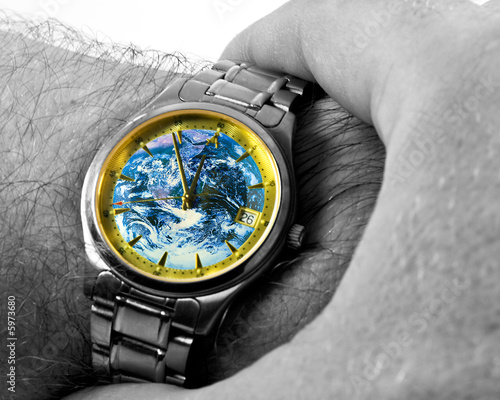 Foto: Watch with Earth face, showing time 11:55 Watch with Earth face, showing time 11:55