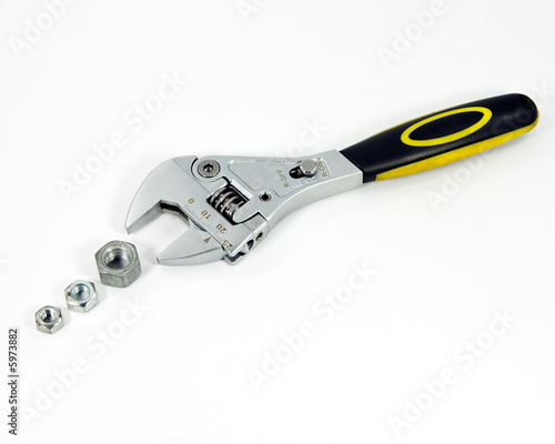Photo: Adjustable ratchet wrench with three different nuts Adjustable ratchet wrench with three different nuts