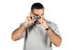 Young man with digital camera shooting away