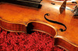 Violin on red carpet