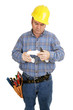 Electrician having trouble assembling plumbing pipe. Isolated