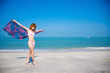 a young girl  walking by the beach