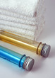 White towels and two bottles with shampoo