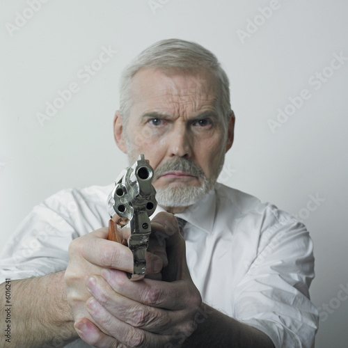 Photo: Old man with handgun Old man with handgun