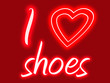 Red and pink sign with glow stating I heart shoes
