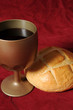 Communion elements close up over a red background