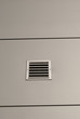 Shiny metal wall with ventilation