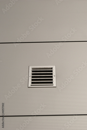 Shiny metal wall with ventilation