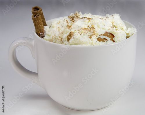 a steaming hot cup of cocoa with cinnamin sticks a steaming hot cup of cocoa with cinnamin sticks