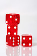 Stack of red and white dice on a white background