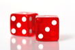 Red and white dice on a white background