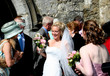 A Happy bride poses outside the church after the wedding A Happy bride poses outside the church after the wedding