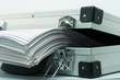 stack of documents in briefcase