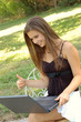 Beautiful young girl working on laptop