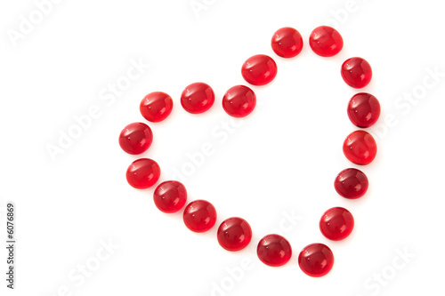 Photo: Red gem stones in a heart shape Red gem stones in a heart shape