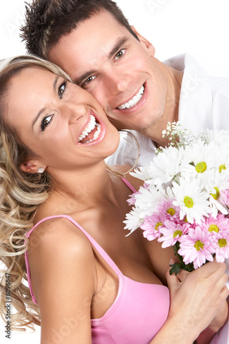 Young love couple smiling. Over white background  .