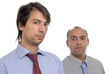 two young business men portrait on white. focus on the right man two young business men portrait on white. focus on the right man