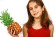 Teen holding large pineapple