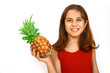 Teen holding large pineapple
