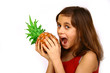 Teen holding large pineapple