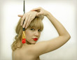 pretty green-eyes girl with brush and red lips