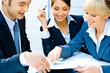 Business woman demonstrating her plan to co-workers 