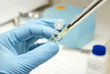 Biotechnology laboratory research tools in the hands in gloves